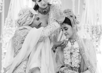 Kriti Sanon helps Stebin Bin apply ‘sindoor’ to Nupur Sanon during their traditional Indian wedding ceremony