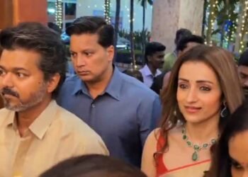 Vijay attending Kalpathi Suresh’s son’s wedding reception with Trisha divides Internet