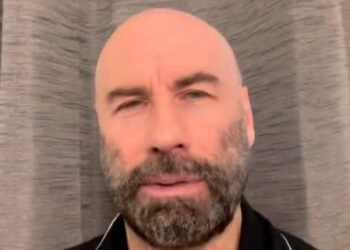 John Travolta reveals why he owns a dozen of berets