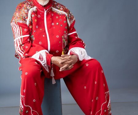 Amitabh Bachchan calls himself ‘overdressed RED’